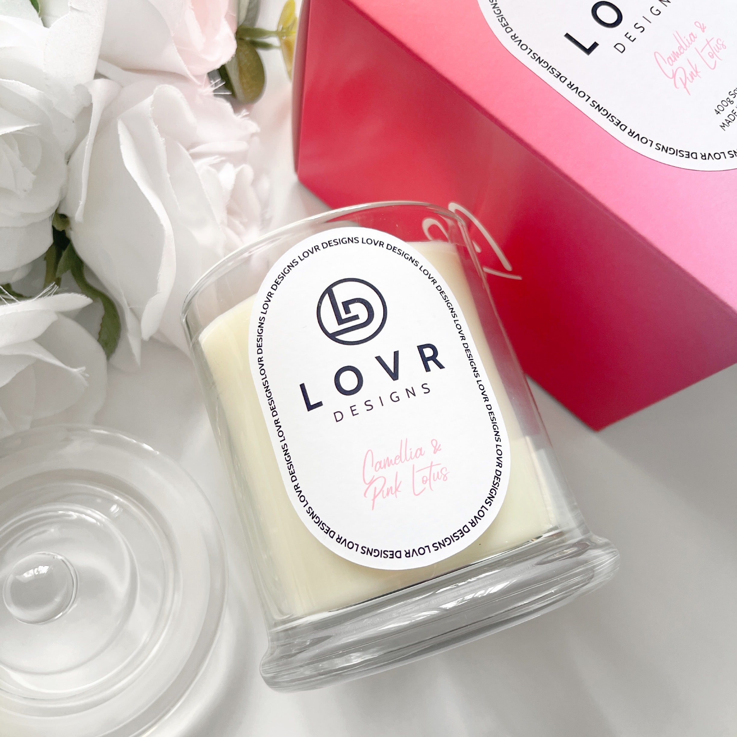 Camellia & Pink Lotus 400g Scented Soy Candle by Lovr Designs, styled with flowers and matching gift box.