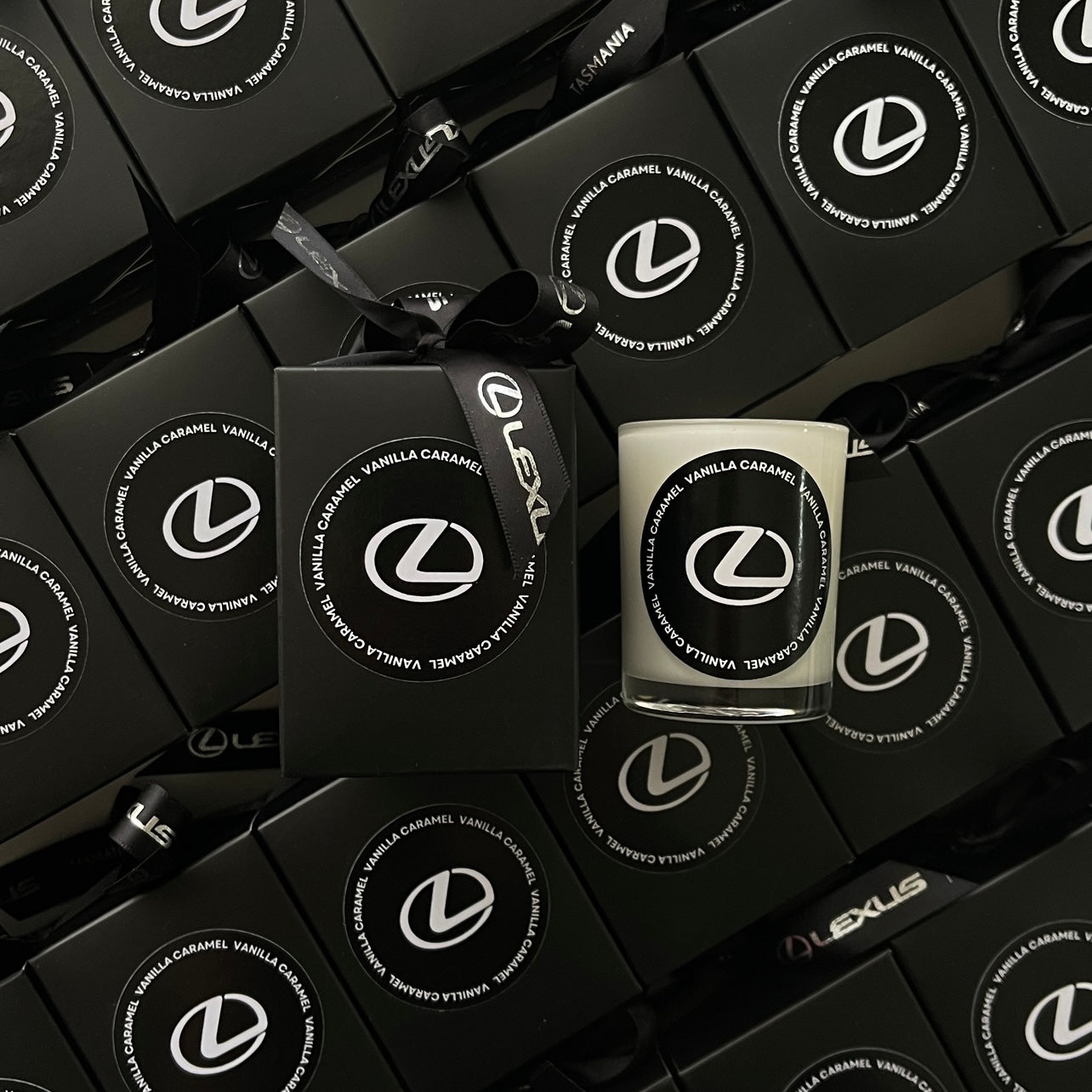 Luxury 60g branded candle and gift box for Lexus Tasmania featuring Vanilla Caramel scent and black-on-black packaging.