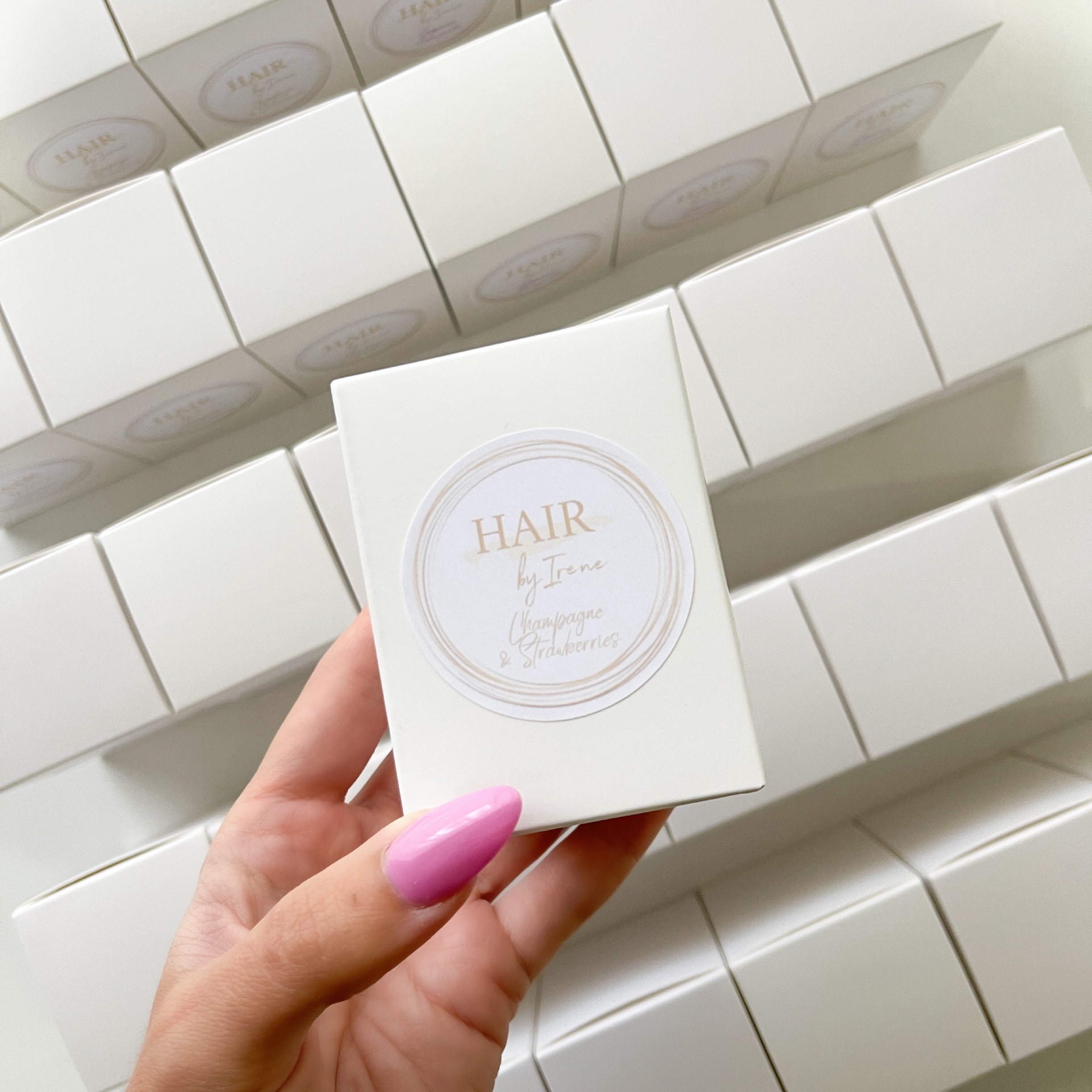 Elegant 60g custom branded candle for Hair by Irene, featuring Champagne & Strawberries scent. Ideal for salon thank-you gifts or branded giveaways.