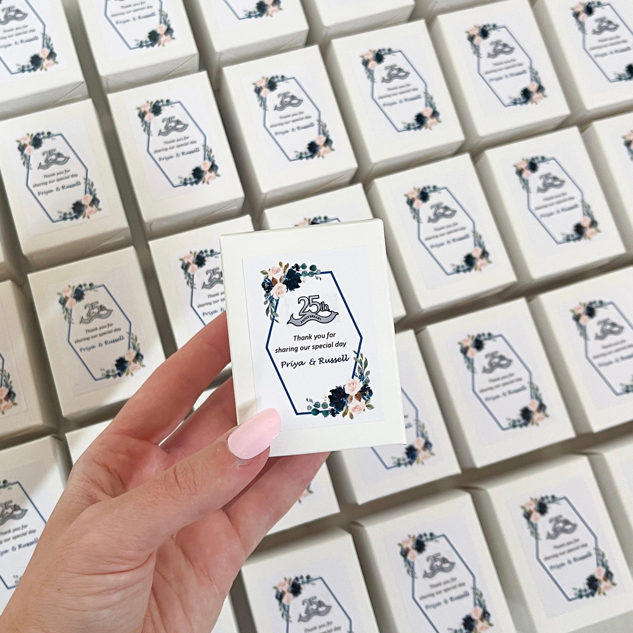 Custom branded 60g soy candles created as thank-you favours for Priya & Russell’s 25th wedding anniversary. Elegant floral label with navy and blush tones.